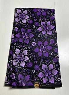 a purple and black floral print fabric