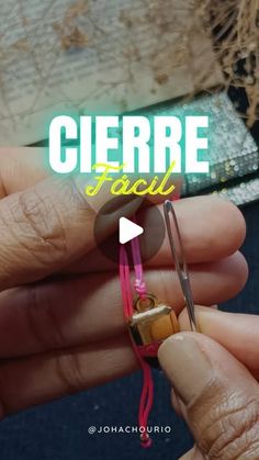 a person holding a pair of scissors in their left hand with the words ciere faci on it