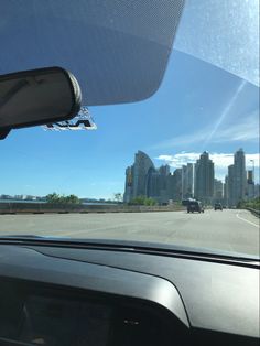 the view from inside a car looking out at a city