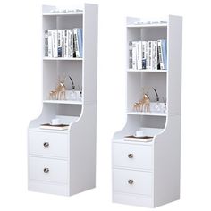 two white bookcases sitting next to each other