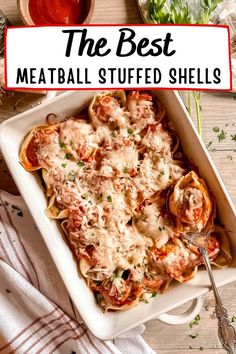 the best meatball stuffed shells in a casserole dish with sauce and parsley