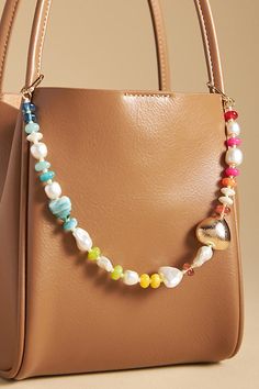 Charming new-trend alert: jewelry for your bag. | Multi-Beaded Bag Charm by Anthropologie in White, Women's, Resin Tote Bag With Charms, Bag Charm Trend 2024, Diy Beaded Bag, 2024 Wardrobe, Key Change, Line Art Flowers, Gift Ideas For Everyone