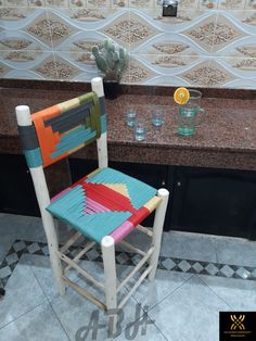 a colorful chair sitting in front of a counter