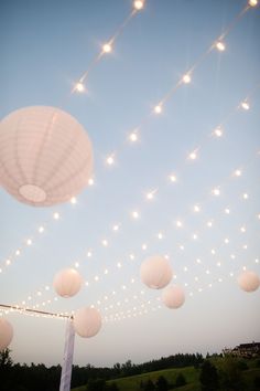 the white party theme ideas page is displayed on an iphone screen, with lights strung over it