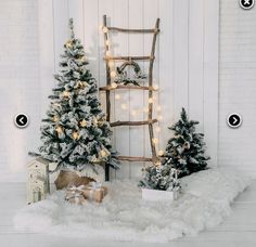 christmas trees and presents in front of a white wall