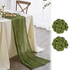 the table is set with green napkins and place settings for two people to eat