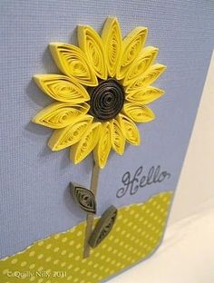 a close up of a greeting card with a sunflower on it's side