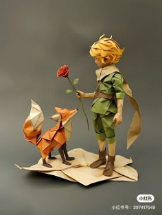 an origami figurine with a fox and a girl holding a rose