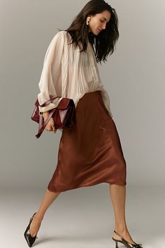 A slip skirt in the truest sense, the on-trend Tilda keeps it simply chic with a French-inspired bias-cut design that makes it drape and move just so . | The Tilda Slip Skirt: Shine Edition by Anthropologie in Brown, Women's, Size: Largearge, Polyester Midi Skirt Pattern, Midi Skirt Outfit, Dark Autumn, Satin Short, Georgette Dress, Simply Chic, Striped Scarves, Slip Skirt, Midi Skirts