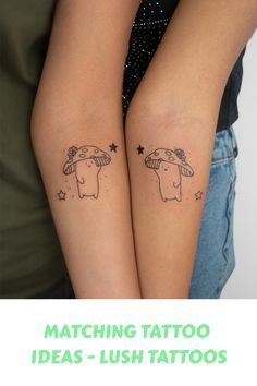 two people with matching tattoos on their arms, one is holding the other's arm