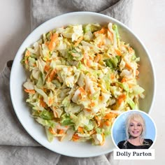 a white bowl filled with coleslaw and carrots next to a photo of dolly parton