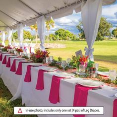 a table set up with pink and white linens for an outdoor wedding or reception