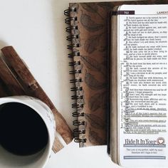 an open bible next to a cup of coffee