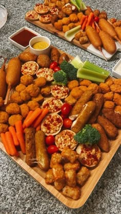 two trays filled with different types of food on top of a table next to each other