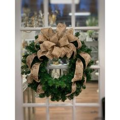 a christmas wreath on a window sill