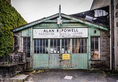 an old run down building that has been boarded up