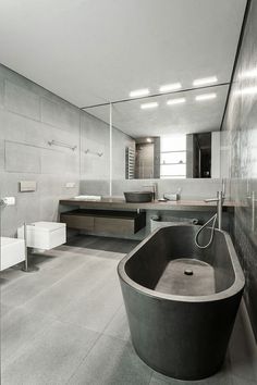 a large bath tub sitting in the middle of a bathroom