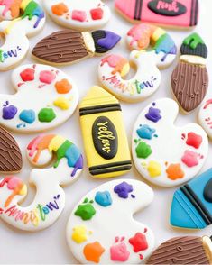 some decorated cookies are laying on a table