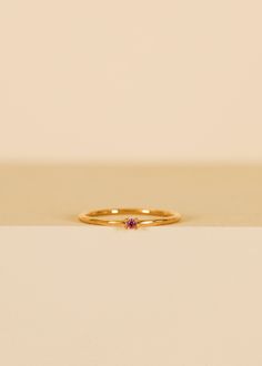 Perfect for making a subtle yet stylish statement. This elegant pinky ring features a dainty, pink cz centerpiece with a sleek band that comfortably hugs the pinky finger, adding a touch of style to any ensemble. Pink Cubic Zirconia18kt gold over brassBand width approx 1 mm Setting approx 2 mmSizes 3,4,5 Matching Pinky Rings, Ring For Pinky Finger, Pinky Rings For Women, Pinky Finger, Pinky Rings, Crystal Stickers, Earring Stand, Jewelry Candles, Crystal Candles