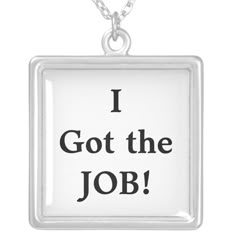 i got the job silver plated necklace with black lettering on it's front