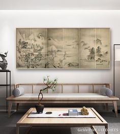 a living room filled with furniture and a painting on the wall above it's coffee table