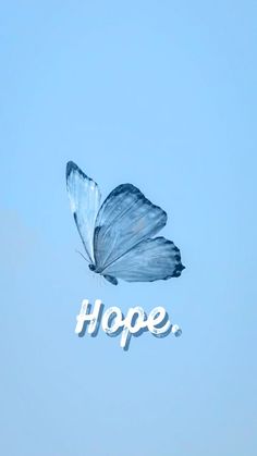 a blue butterfly flying in the sky with hope written on it's back side