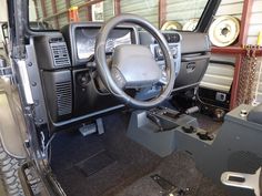 the interior of a vehicle with its dashboard and steering wheel in place for repairs or repair