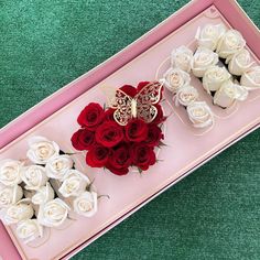 two boxes with roses and a butterfly on them