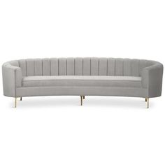 a grey couch with gold legs