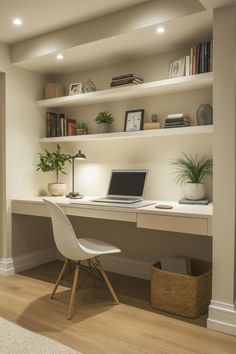 a desk with a laptop on it in front of a bookshelf and shelves