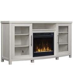 an entertainment center with a fireplace and shelves