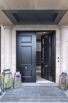 two black doors and three lanterns in front of them