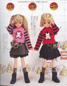 two dolls are standing next to each other