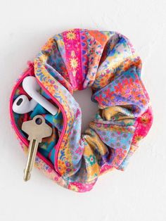 a colorful tie dye scrunffle with keys in it