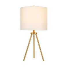 the golden tripod table lamp with a white shade