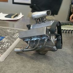 an old motorcycle engine is sitting on the table