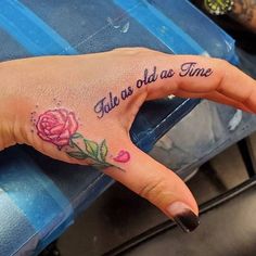 a woman's hand with a tattoo on it that says, all she has time