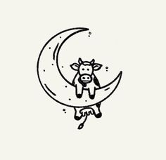 a cow is sitting on the moon with its head hanging over it's shoulder