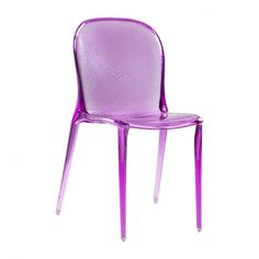 a purple plastic chair sitting on top of a white floor