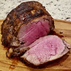 a large piece of meat sitting on top of a cutting board