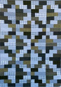 a blue and black quilt with squares on it's sides, in the shape of rectangles