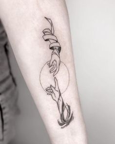 a woman's arm with a tattoo on it