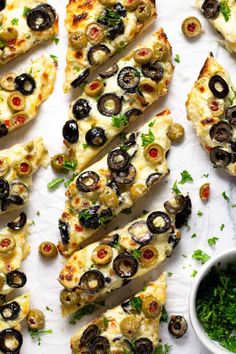 pizza with olives and parsley on top