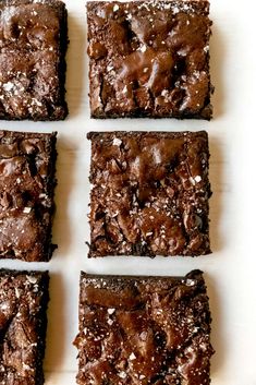 four squares of brownies with sea salt on top