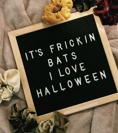 a sign that says it's friskin bats i love halloween next to scrunchys