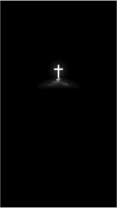 the cross is lit up in the dark