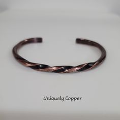 This artisan copper cuff bracelet has been handcrafted from copper wire. It has been hammered, forged, twisted, and shaped to  create this beautiful copper cuff bracelet. The perfect gift for him, or her, as a copper anniversary gift for your 7th, or 22nd Copper Wedding Anniversary!   It is ready to ship in a size 6 1/2 inch length, with a 1 1/4 inch opening. It will fit wrists measuring up to 7 3/4. Please note ~ All other sizes are made to order! Production times may vary, so if you need it in Copper Wedding Anniversary, Copper Ornaments, Copper Anniversary Gifts, Copper Anniversary, Copper Wedding, Anniversary Gift For Him, Copper Cuff Bracelet, Copper Art, Copper Cuff