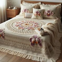 a white bed with pink flowers on it