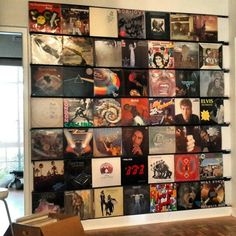 there is a wall that has many records on it