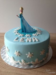 a frozen princess cake with frosting on top